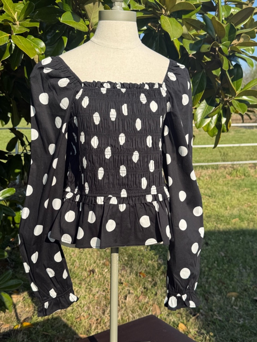Francesca's Collections Black and White Polka Dot Smocked Peplum Top